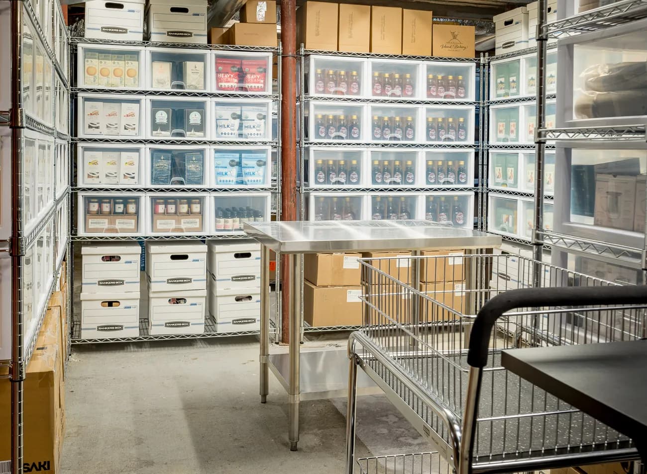 Shelves of tea, coffee and pantry goods stored in Mellifera's climate-controlled warehouse