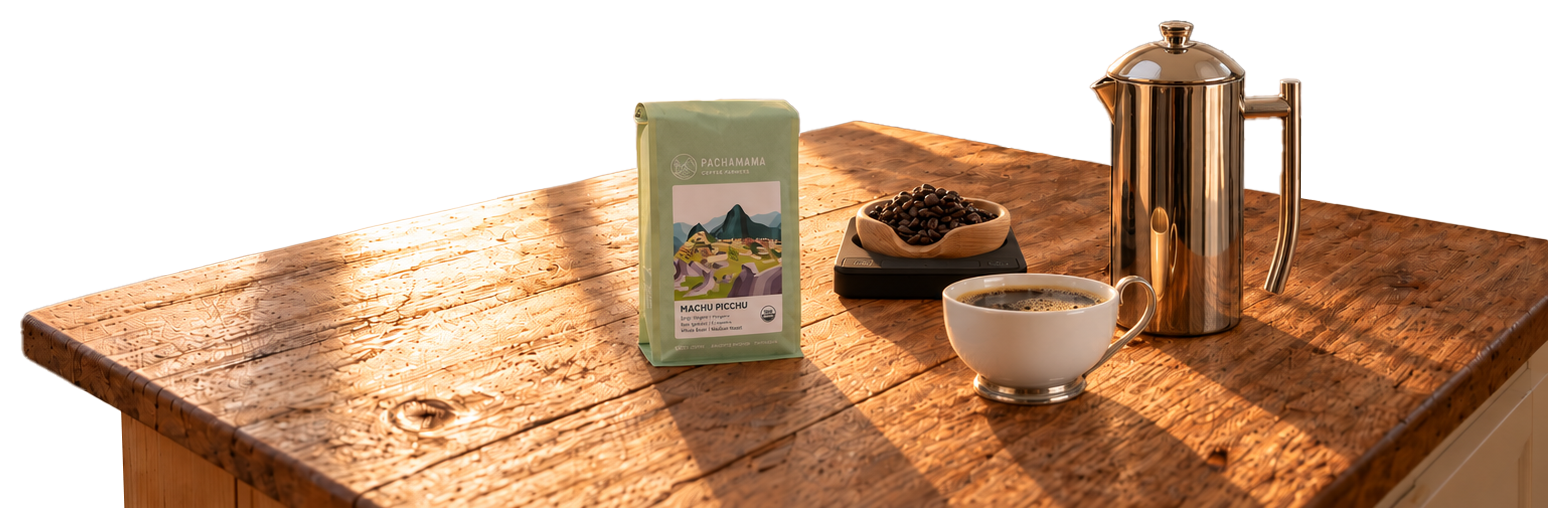 Coffee prepared on a wooden kitchen table, set against a mountain landscape.